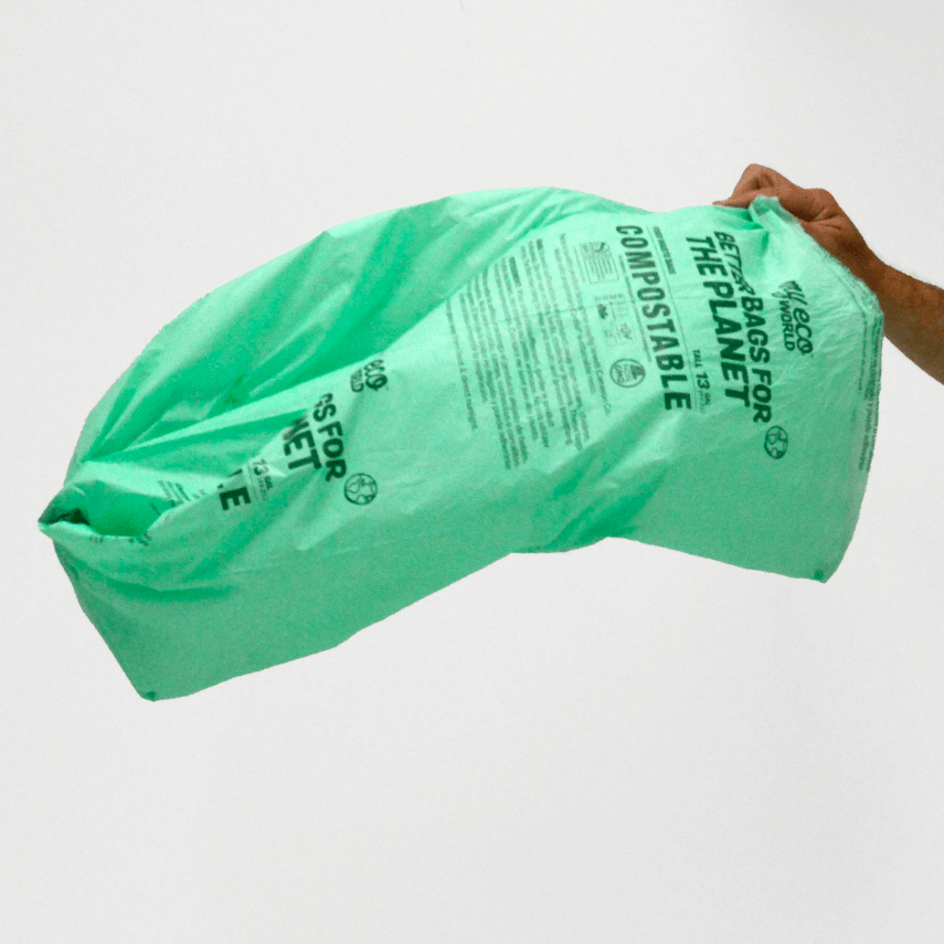 13 gallon MyEcoWorld Bag being held by a hand flowing in wind.